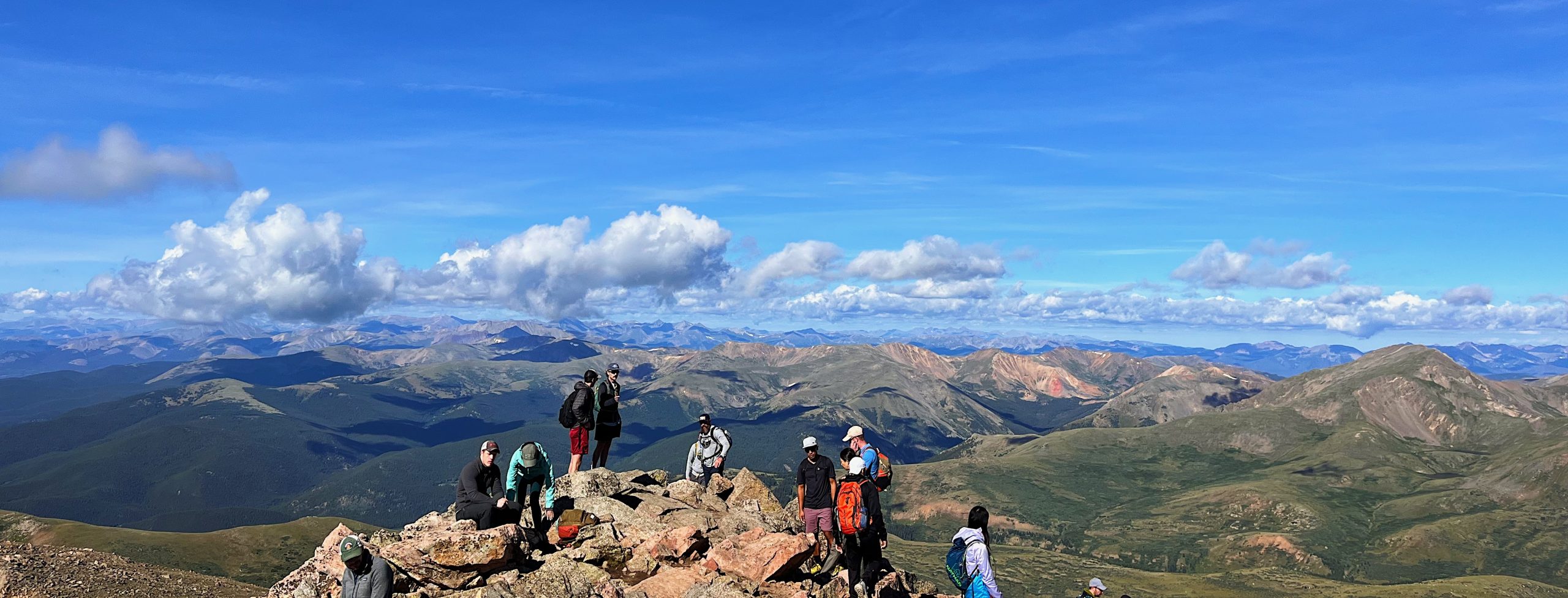 Group of hikers on Mount Bierstadt showing how real outdoor experiences and consumer behavior inform outdoor recreation industry marketing in 2026.